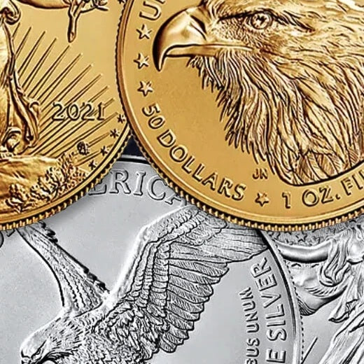 Gold and silver American Eagle coins with detailed designs.